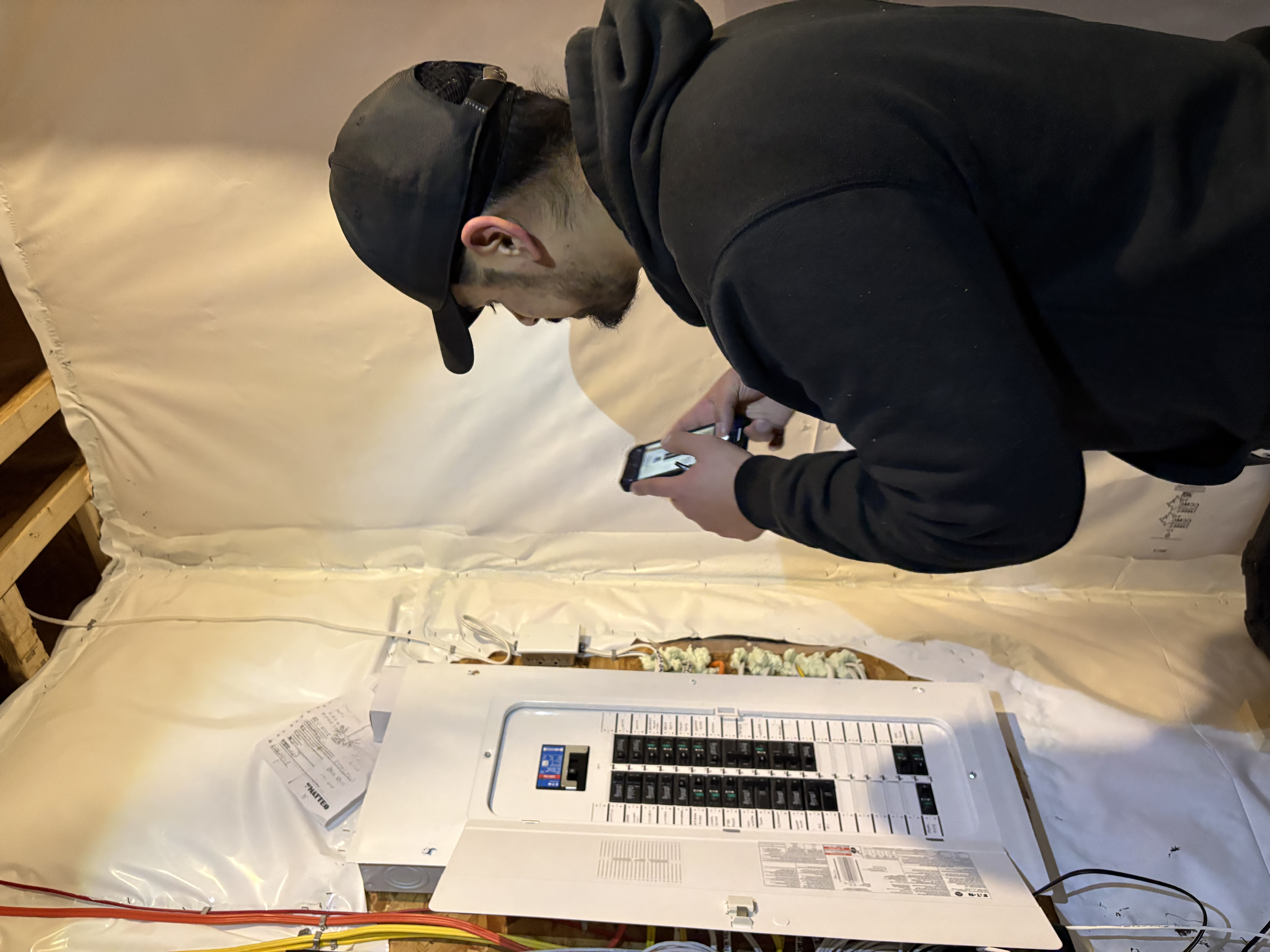 Professional home inspector examining electrical systems